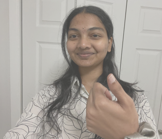 Mythri smiling at the camera
